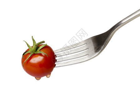 樱桃西红柿被叉子加压图片