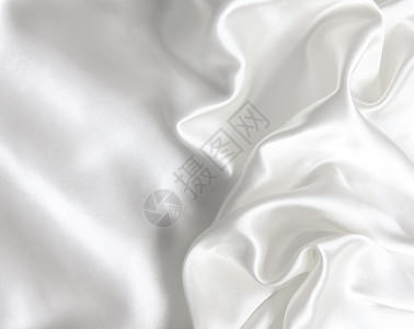 作为婚礼背景的平滑优雅白色丝绸材料涟漪折痕投标布料曲线织物纺织品海浪银色图片