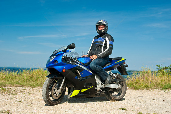 摩托车手男人游客头盔爱好黑色安全国家蓝色自由赛车手图片
