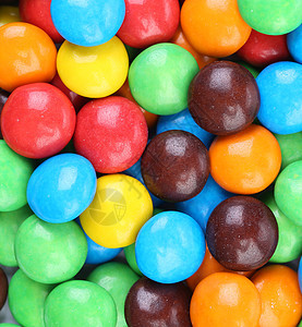 巧克力球在多彩的冰淇淋里回味活力黄色白色水果滴甜点圆形按钮绿色红色多样性图片
