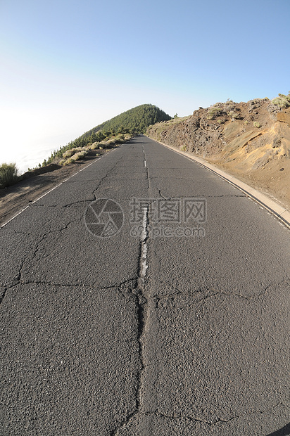 孤独路驾驶沥青皂角公园红色天空蓝色运输风景岩石图片