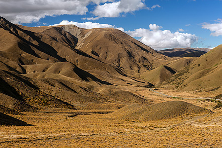 Lindis 过道棕色晴天天空山脉风景丘陵蓝色太阳高山日落图片