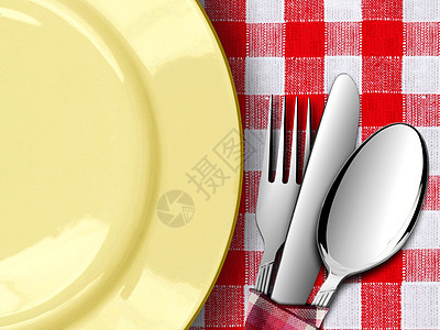 红桌布上用叉子和刀图片