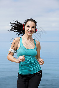 慢跑运动海滩跑步活动速度女性赛跑者行动女孩运动员图片