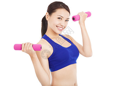 微笑着的女士 用哑铃在她手里工作训练重量女性身体工作室运动装数字运动减肥运动员图片