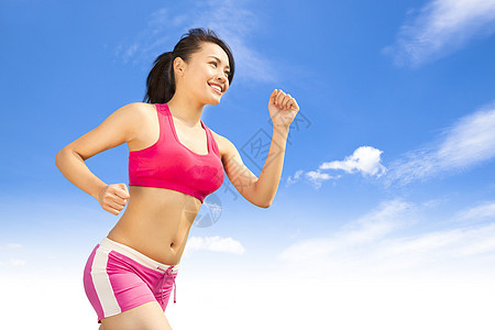 在阳光明媚的日子里 女跑步的女性运动微笑慢跑行动蓝色赛跑者锻炼训练运动装运动员图片