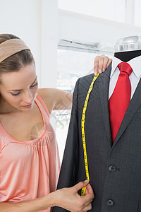 女时装设计员测量假体服装手工剪裁女士职业卷尺模特工作外套设计师礼服图片