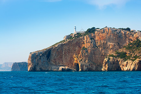 地中海阿利坎特海的纳奥角灯塔岩石海岸天空地标假期海岸线旅行天堂石头海浪图片