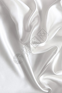 平滑优雅的白色丝绸作为背景材料曲线折痕纺织品投标涟漪海浪新娘银色织物图片