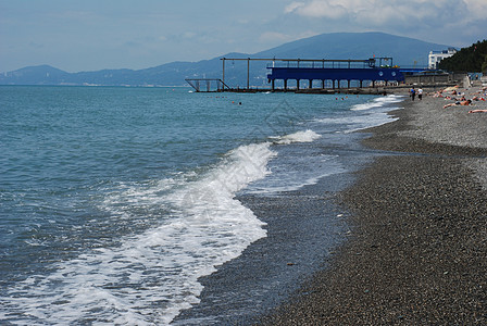 黑海海岸海浪海滩卵石石头黑色图片