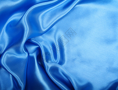 平滑优雅的蓝色丝绸作为背景海浪曲线纺织品折痕织物投标材料天蓝色布料银色图片