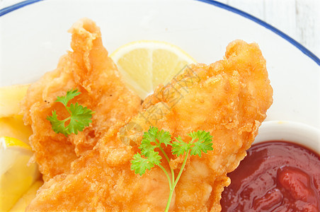 鱼和薯片英语海鲜垃圾食物油炸饮食薯条柠檬面糊宏观图片