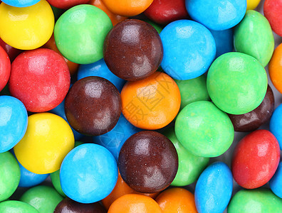 巧克力球在多彩的冰淇淋里回味团体诱惑食物按钮甜点黄色红色圆形绿色釉面图片