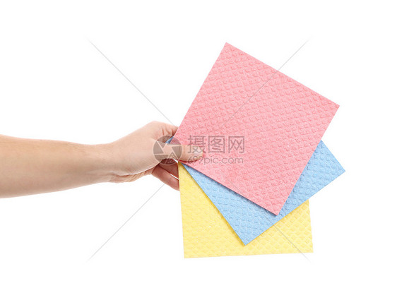 手握着不同的海绵黄色橡皮卫生工作蓝色抹布正方形粉色清洁女佣图片