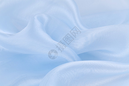 蓝色丝绸的背景材料床单织物衣服编织窗帘图片