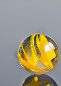 黄黄色玻璃圆珠气泡宏观反射条纹圆圈曲线漩涡休闲游戏地球图片