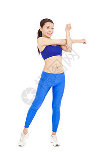 美丽的漂亮漂亮的女人 伸展她的手臂 微笑着笑容运动装女性女孩肌肉健身房运动员工作室训练身体运动图片