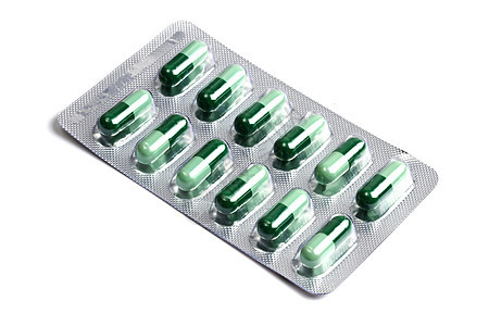 白色隔离的一包绿色胶囊药品医院药片店铺宏观治疗药剂团体疾病医疗图片