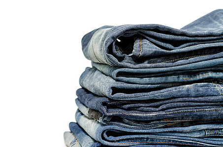 蓝蓝色牛仔裤堆叠棉布衣服材料口袋牛仔布棉纺厂纺织品纹理宏观单线图片