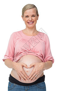 怀着幸福的孕妇手放在肚子上图片