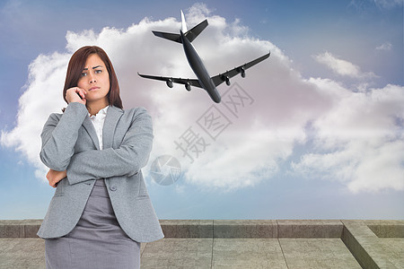 令人忧心的女商务人士综合形象旅行职业头发商务飞机航空阳台飞行女士人士图片