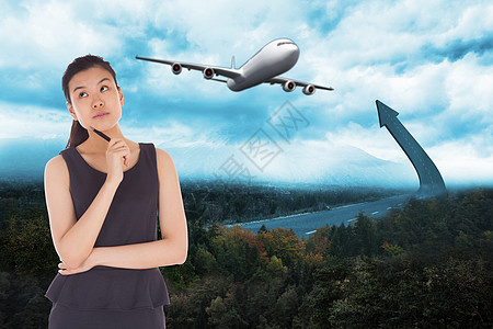 商业女思考者的综合形象旅行黑发裙子商务环境计算机马尾辫女性天空航班图片