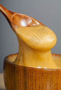 金金蜂蜜木头营养液体金子产品流动勺子食物糖浆桌子图片