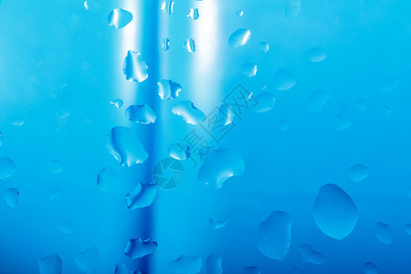 蓝色带水滴的抽象背景珠子气泡液体艺术黄色飞沫玻璃宏观金属雨滴图片
