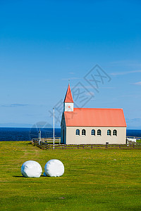 典型的农村冰地教堂历史蓝色阳光地平线尖顶海洋场地建筑场景石头图片