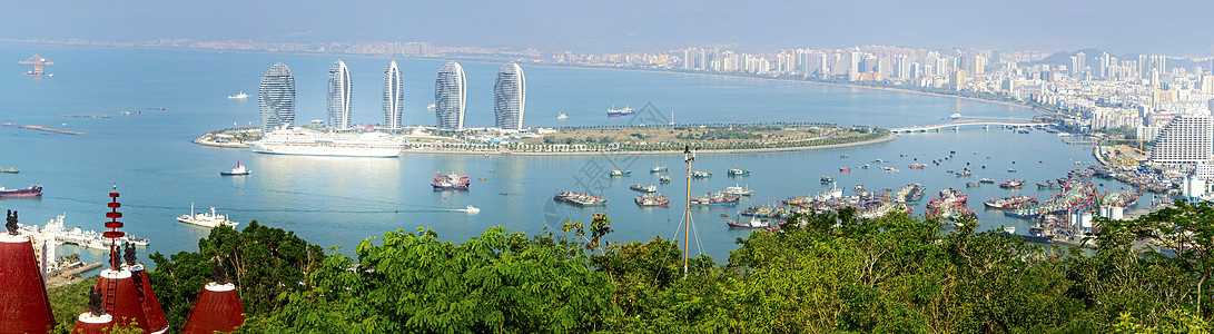 海南岛三亚湾环保热带海滩房地产海洋天空旅行图片