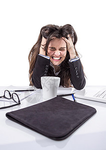 紧张的女商务人士拉扯她的头发职业商业女孩女士悲伤压力工作女性头痛电脑图片