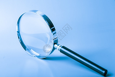 蓝色放大镜侦探勘探科学调查玻璃镜片乐器工具学习白色图片