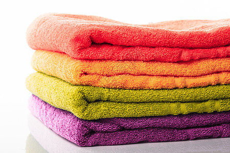 隔离的堆叠毛巾纤维家庭棉布淋浴折叠洗衣店纺织品织物紫色温泉图片