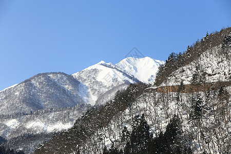 高山日本山的雪覆盖山首脑公吨观光胜地风景蓝天环境五龙天空生态图片