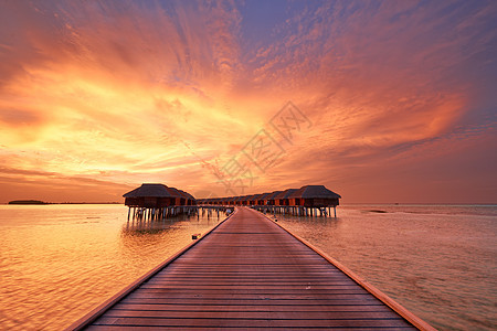马尔代夫海滩日落房子天空海洋热带别墅阳光蓝色海岸线海滩奢华图片