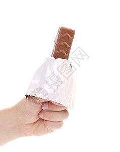 手握着黑巧克力棒甜点坚果小吃巧克力白色可可食物糖果焦糖糖果棒图片