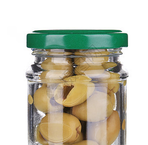 在罐子里放绿色橄榄盐水食物玻璃美食小吃罐装蔬菜杂货宏观白色图片