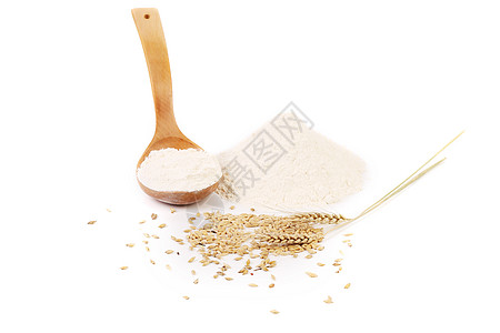 大米面粉面粉小麦耳和木勺背景