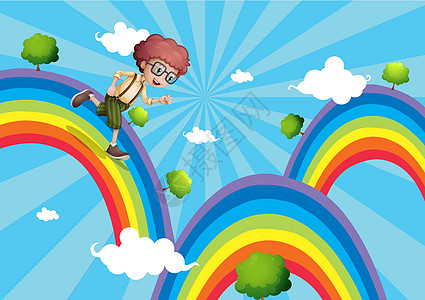 一个男孩走在彩虹顶端图片