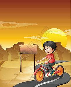 一个男孩在沙漠里骑自行车 带着空的招牌图片