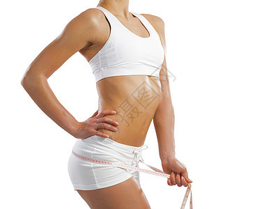 腰部的年轻运动女性营养身体橘皮组织女士健身房腹部食物减肥水果图片