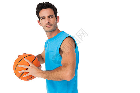 带球的严肃篮球运动员蓝色双手训练肌肉播放器男性游戏运动运动服行动图片