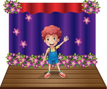 舞台 一个年轻男孩挥舞着欢乐的微笑图片