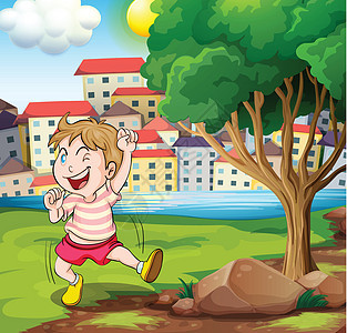 一个快乐的孩子 靠近树附近 在河岸边的树图片