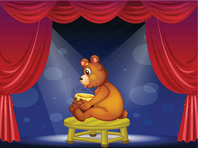 一只熊 在舞台上坐着一锅蜂蜜图片