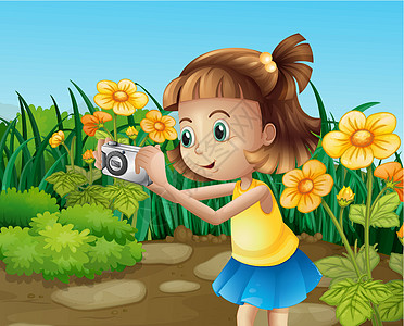 一个女孩在花园里拍照片图片