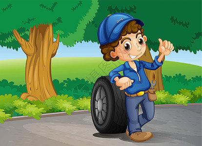 一个男孩和一个轮胎在路上图片