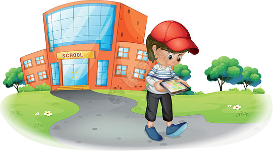 一个男孩在学校附近拿着一个小玩意图片