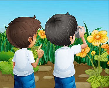 两个男孩拍着花的相片图片