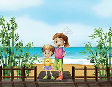 海滩附近桥上的一个男孩和一个女孩图片